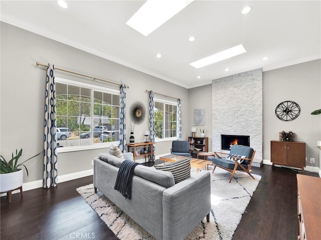 183 W Sidlee St, Thousand Oaks, CA 91360 - living room featuring a stone fireplace, a skylight, recessed lighting, hardwood / wood-style floors, and ornamental molding