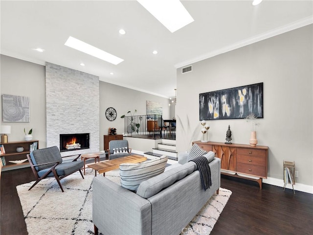 183 W Sidlee St, Thousand Oaks, CA 91360 - living room featuring a skylight, crown molding, wood finished floors, a fireplace, and recessed lighting