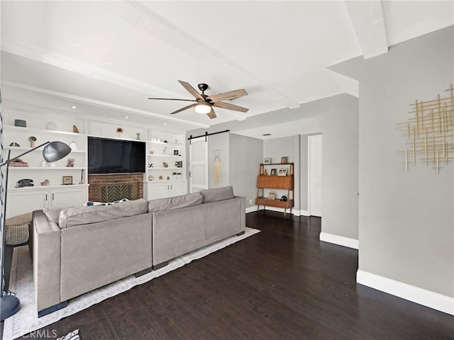183 W Sidlee St, Thousand Oaks, CA 91360 - living room with a barn door, a ceiling fan, wood finished floors, and built in features
