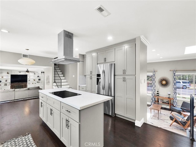 183 W Sidlee St, Thousand Oaks, CA 91360 - kitchen featuring stainless steel fridge, island exhaust hood, black electric stovetop, dark wood-type flooring, and a ceiling fan