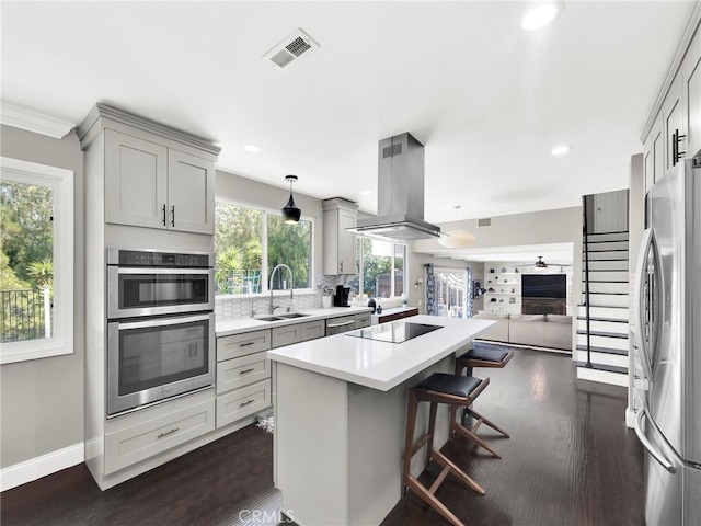 183 W Sidlee St, Thousand Oaks, CA 91360 - kitchen featuring island range hood, stainless steel appliances, gray cabinetry, a kitchen island, and open floor plan
