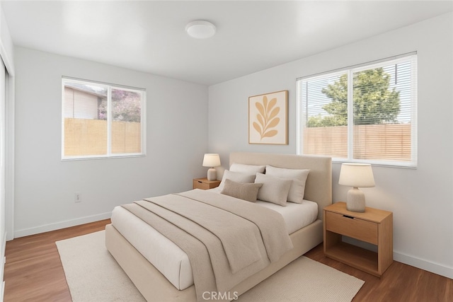 715 N 3rd St, Lompoc, CA 93436 - bedroom with baseboards and wood finished floors