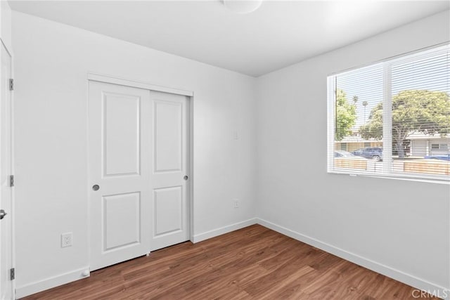 715 N 3rd St, Lompoc, CA 93436 - unfurnished bedroom featuring wood finished floors and a closet