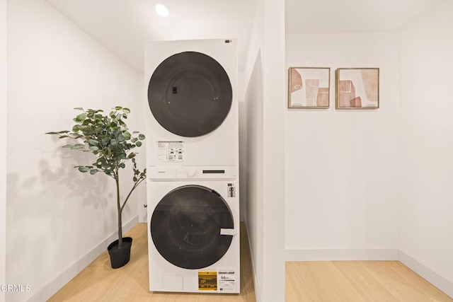 70 N Catalina Ave Unit 101, Pasadena, CA 91106 - washroom featuring stacked washer / drying machine and wood finished floors