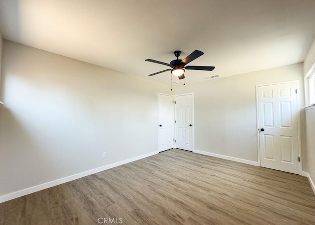 6692 Elm Ave, San Bernardino, CA 92404 - unfurnished bedroom featuring wood finished floors, ceiling fan, and a closet