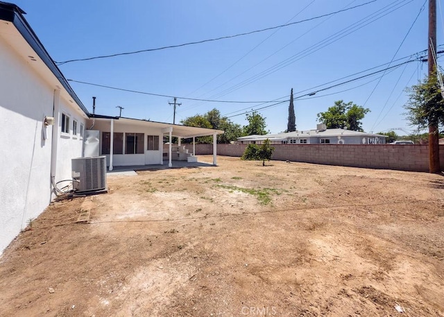 6692 Elm Ave, San Bernardino, CA 92404 - fenced backyard with a patio area