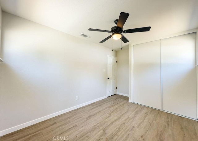 6692 Elm Ave, San Bernardino, CA 92404 - unfurnished bedroom with wood finished floors, a closet, and a ceiling fan