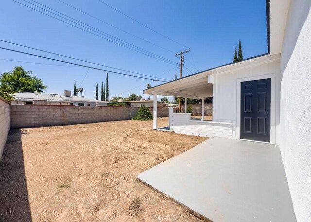 6692 Elm Ave, San Bernardino, CA 92404 - fenced backyard featuring a patio