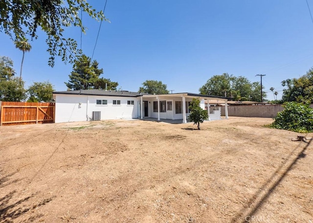 6692 Elm Ave, San Bernardino, CA 92404 - back of property featuring a fenced backyard and a sunroom
