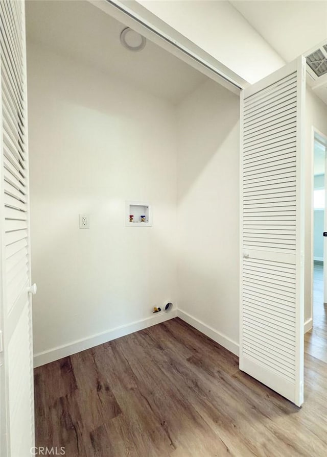 6692 Elm Ave, San Bernardino, CA 92404 - laundry room with washer hookup and light wood-style flooring