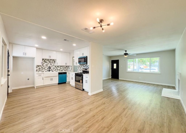6692 Elm Ave, San Bernardino, CA 92404 - kitchen featuring stainless steel gas stove, dishwasher, white cabinets, decorative backsplash, and open floor plan
