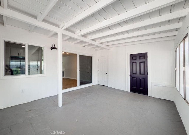 6692 Elm Ave, San Bernardino, CA 92404 - unfurnished sunroom featuring beam ceiling