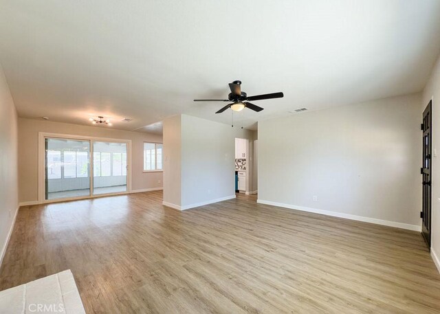 6692 Elm Ave, San Bernardino, CA 92404 - unfurnished living room featuring light wood finished floors and a ceiling fan
