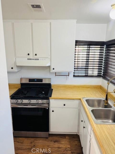 98 Lori Way, Banning, CA 92220 - kitchen featuring stainless steel range with gas cooktop, under cabinet range hood, white cabinets, light countertops, and dark wood finished floors