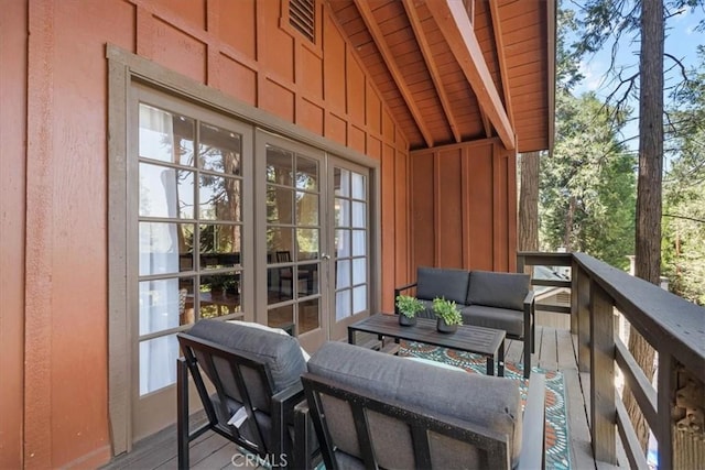 23717 Scenic Dr, Crestline, CA 92325 - view of wooden balcony with french doors, an outdoor hangout area, and a deck