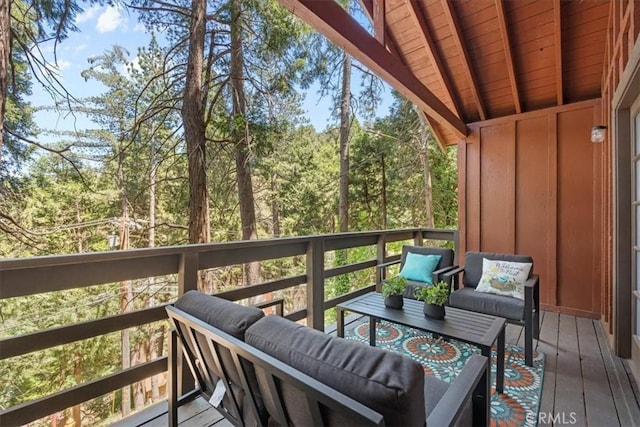 23717 Scenic Dr, Crestline, CA 92325 - wooden terrace with an outdoor living space and a view of trees