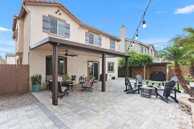 339 Alamo Way, Oceanside, CA 92057 - rear view of property featuring a fire pit, stucco siding, a chimney, ceiling fan, and a patio