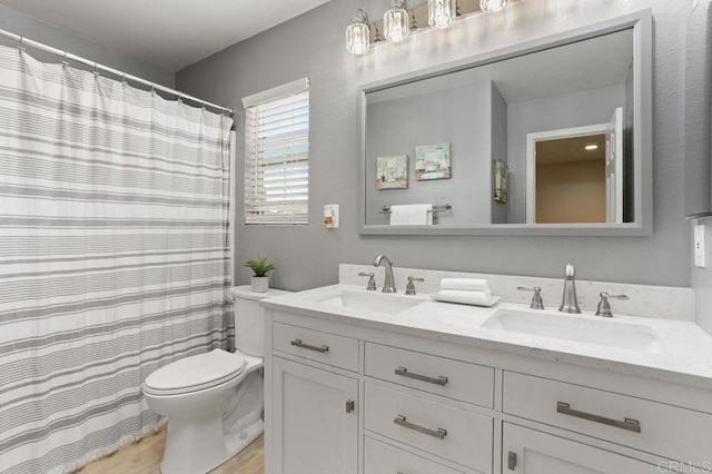 339 Alamo Way, Oceanside, CA 92057 - bathroom with double vanity, wood finished floors, and a shower with shower curtain