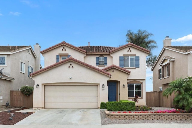 339 Alamo Way, Oceanside, CA 92057 - mediterranean / spanish home featuring driveway, stucco siding, a garage, and a tile roof