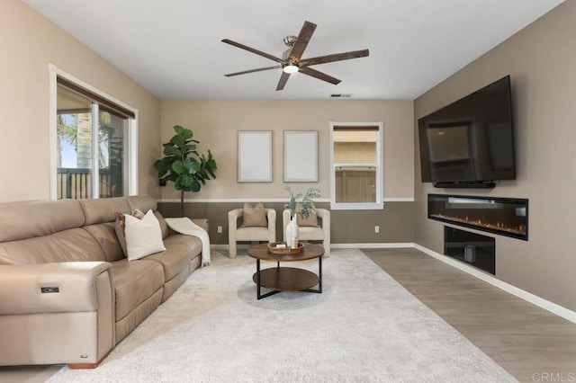 339 Alamo Way, Oceanside, CA 92057 - living room with wood finished floors, a ceiling fan, and a glass covered fireplace
