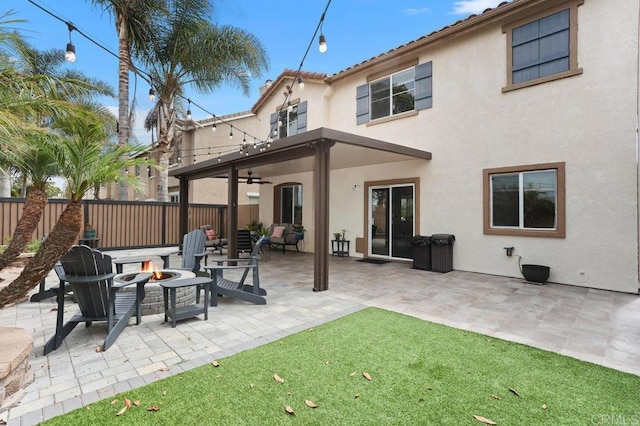 339 Alamo Way, Oceanside, CA 92057 - back of house with a fire pit, a ceiling fan, stucco siding, and a patio area
