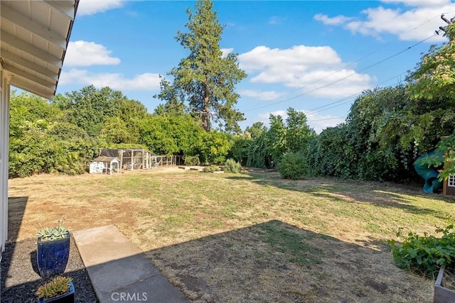 18 El Cerrito Dr, Chico, CA 95973 - view of grassy yard featuring an outdoor structure and exterior structure