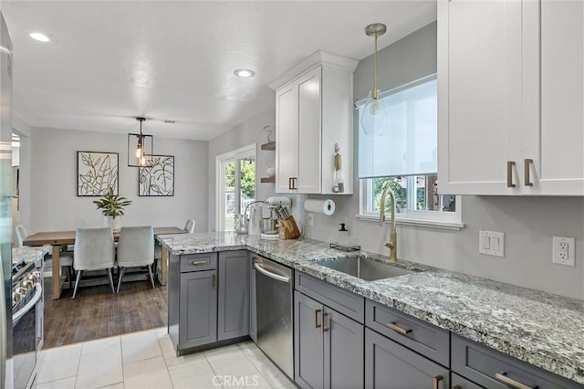 18 El Cerrito Dr, Chico, CA 95973 - kitchen featuring appliances with stainless steel finishes, gray cabinets, white cabinetry, light stone countertops, and recessed lighting