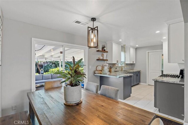 18 El Cerrito Dr, Chico, CA 95973 - dining area with light tile patterned floors and recessed lighting