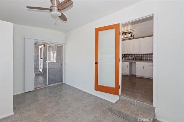 62171 Campanula St, Joshua Tree, CA 92252 - spare room with french doors, light tile patterned floors, and a ceiling fan