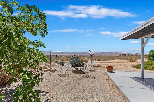62171 Campanula St, Joshua Tree, CA 92252 - view of yard with an outdoor fire pit and a mountain view