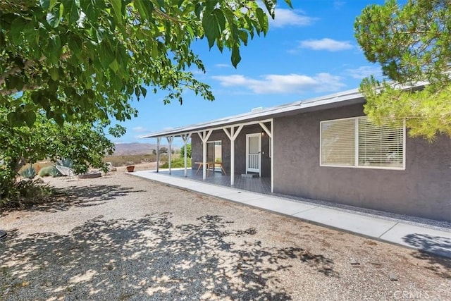 62171 Campanula St, Joshua Tree, CA 92252 - rear view of house featuring stucco siding