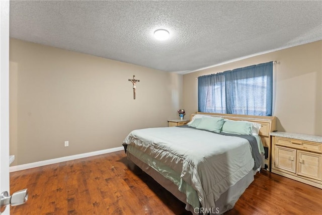 5983 Jones Ave, Riverside, CA 92505 - bedroom featuring a textured ceiling and wood finished floors