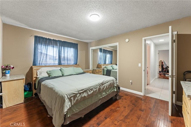 5983 Jones Ave, Riverside, CA 92505 - bedroom featuring a textured ceiling, hardwood / wood-style floors, and a closet
