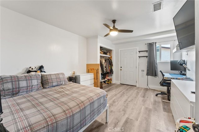 5983 Jones Ave, Riverside, CA 92505 - bedroom with a desk, light wood-style flooring, a closet, and a ceiling fan