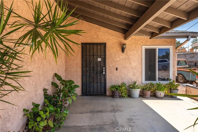 5983 Jones Ave, Riverside, CA 92505 - entrance to property with stucco siding and a patio