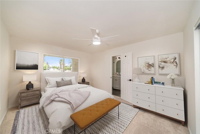 40911 Lela May Ave, Hemet, CA 92544 - bedroom with light carpet, a ceiling fan, and connected bathroom