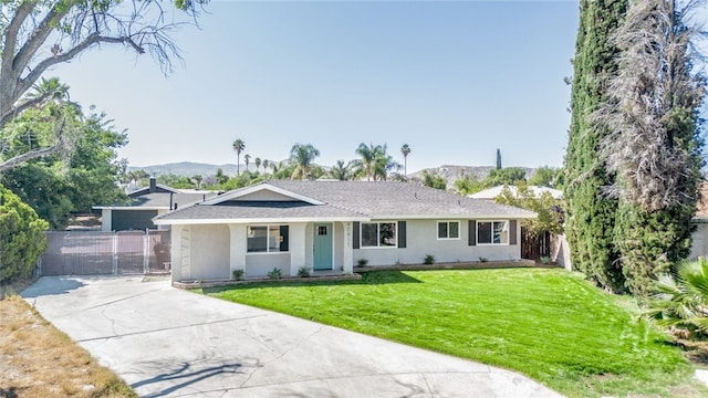 40911 Lela May Ave, Hemet, CA 92544 - ranch-style house featuring concrete driveway, stucco siding, a mountain view, a shingled roof, and a gate