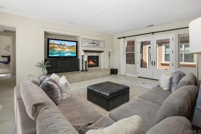 13388 Greenstone Ct, Scripps Miramar, CA 92131 - living area with tile patterned flooring, french doors, and a premium fireplace