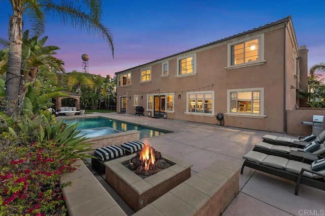 13388 Greenstone Ct, Scripps Miramar, CA 92131 - pool at dusk featuring a fire pit, an outdoor pool, a patio area, a gazebo, and area for grilling