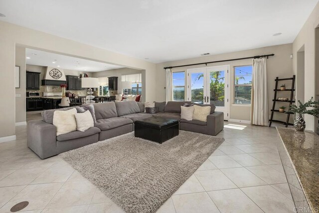 13388 Greenstone Ct, Scripps Miramar, CA 92131 - living room featuring light tile patterned floors and recessed lighting
