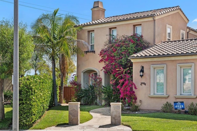 13388 Greenstone Ct, Scripps Miramar, CA 92131 - mediterranean / spanish house featuring a chimney, a tile roof, and stucco siding
