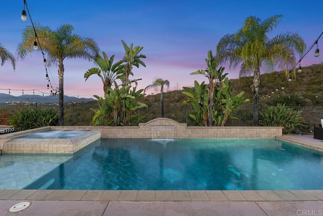 13388 Greenstone Ct, Scripps Miramar, CA 92131 - pool at dusk with a pool with connected hot tub