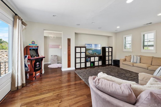 13388 Greenstone Ct, Scripps Miramar, CA 92131 - living room featuring wood finished floors, recessed lighting, and a chandelier