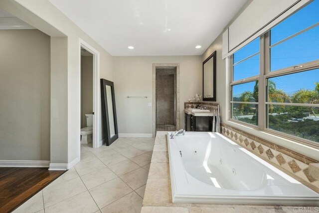 13388 Greenstone Ct, Scripps Miramar, CA 92131 - full bathroom with a jetted tub, vanity, tiled shower, and recessed lighting
