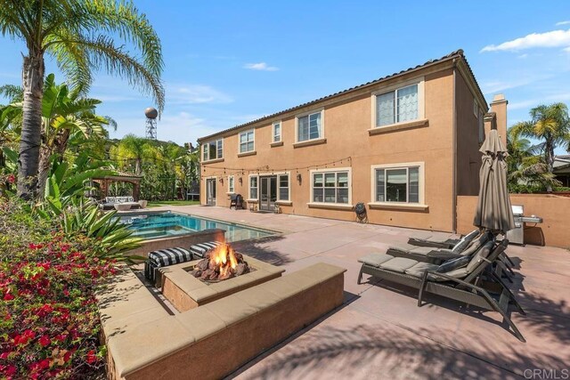 13388 Greenstone Ct, Scripps Miramar, CA 92131 - view of swimming pool with a fire pit and a patio area