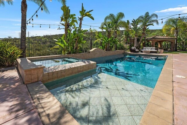 13388 Greenstone Ct, Scripps Miramar, CA 92131 - view of pool featuring a gazebo, a patio area, and a pool with connected hot tub