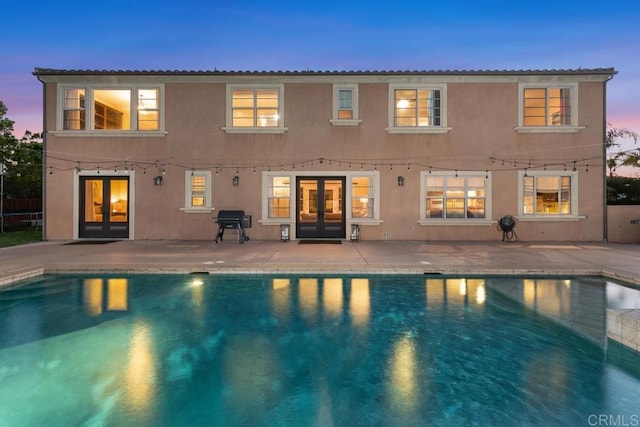 13388 Greenstone Ct, Scripps Miramar, CA 92131 - back of property with french doors, an outdoor pool, and stucco siding