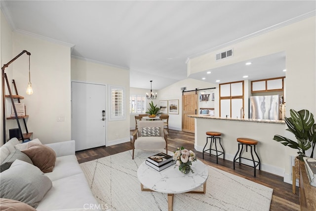 55 Rabano Unit 240, Rancho Santa Margarita, CA 92688 - living area with a barn door, a chandelier, crown molding, dark wood-style flooring, and recessed lighting