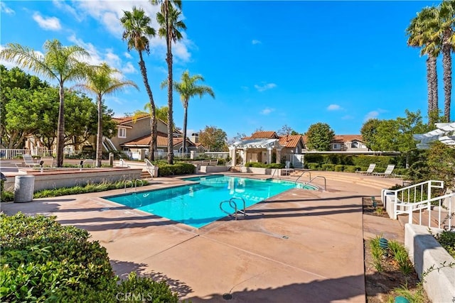 55 Rabano Unit 240, Rancho Santa Margarita, CA 92688 - community pool featuring a pergola, a residential view, and a patio