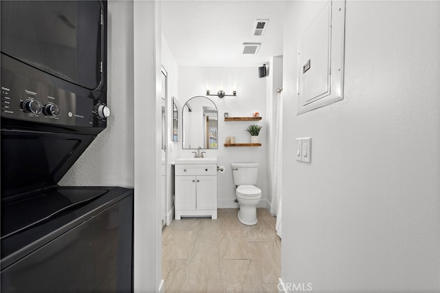 55 Rabano Unit 240, Rancho Santa Margarita, CA 92688 - bathroom with vanity, stacked washing machine and dryer, and electric panel